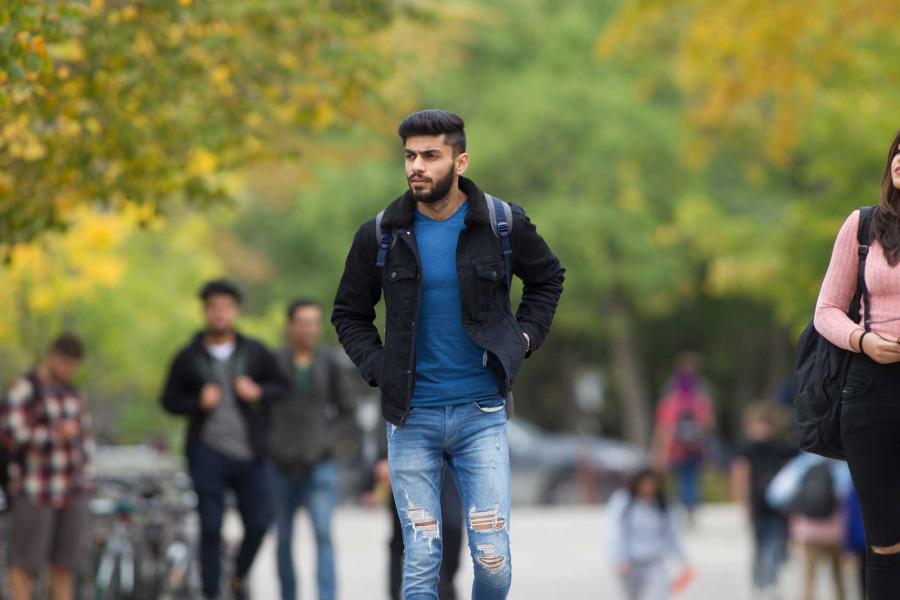 A student walking on campus.