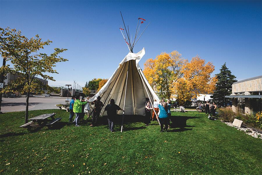 Image of a teepee in UM's green space.