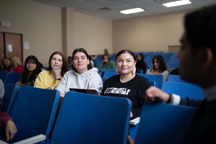 Students seated in an theatre classroom.