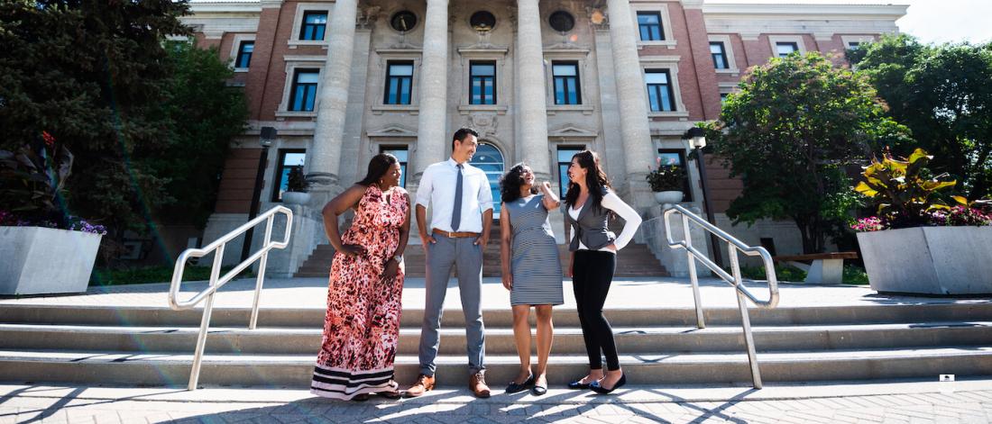 international students standing in front of admin building