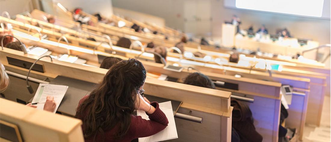 Students are taking notes in the lecture hall.