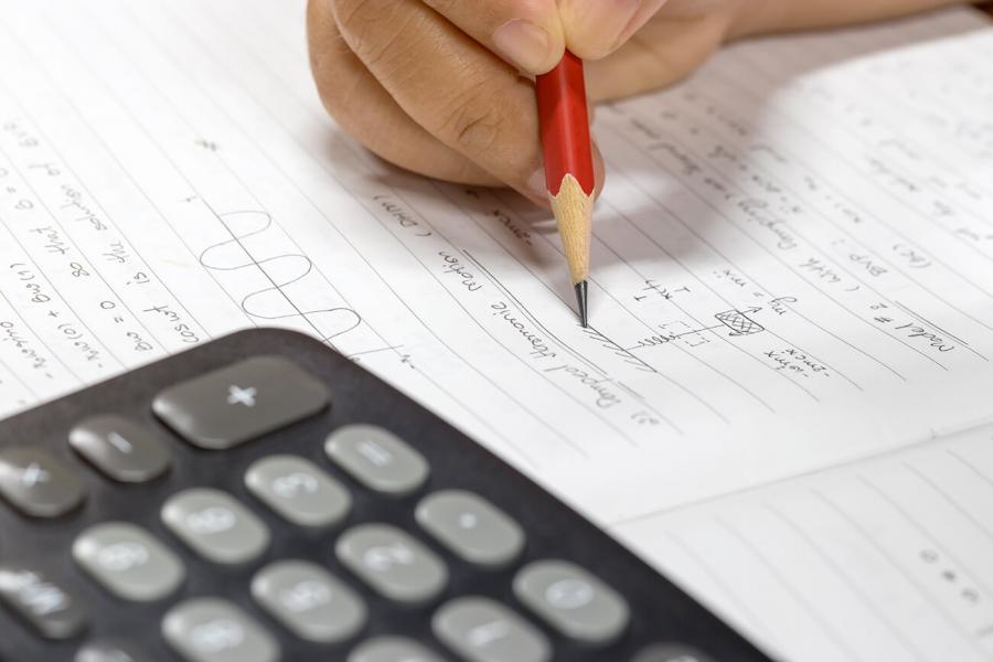 Math equation completed by hand