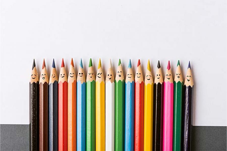 This image shows a group of colored pencils on a white background. 