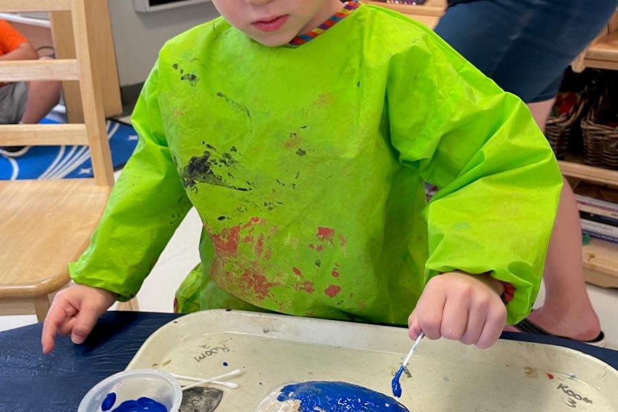 Painting rocks at Campus Children Centre