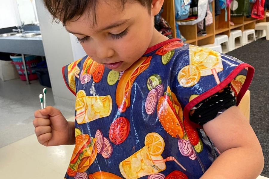 Painting rocks at Campus Children Centre