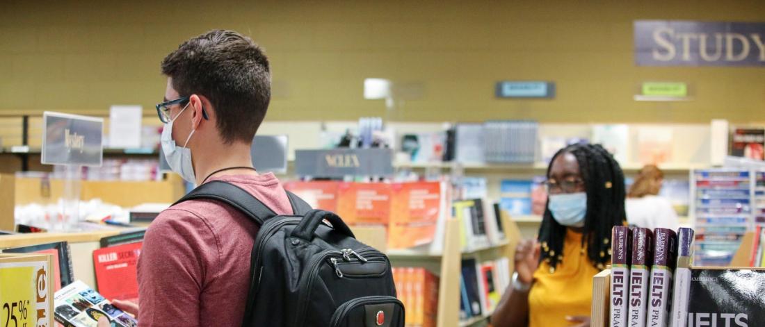 Students wearing personal protective masks in the Bookstore.