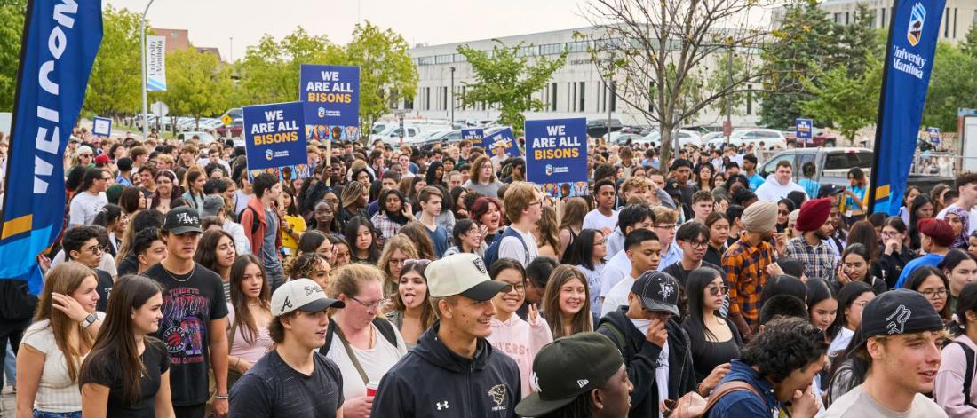 a group of UM students walking outside on campus