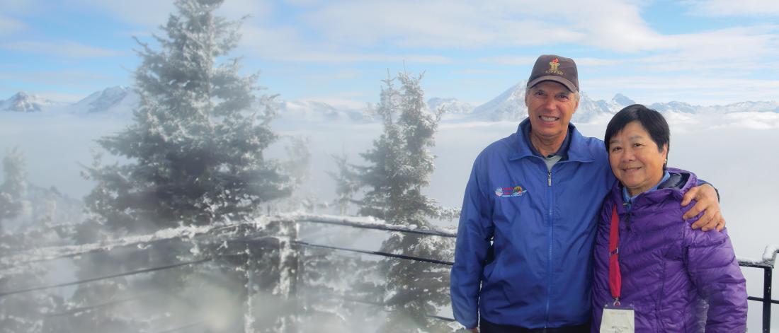 Rick and Paulina Zillman posing in front of mountains