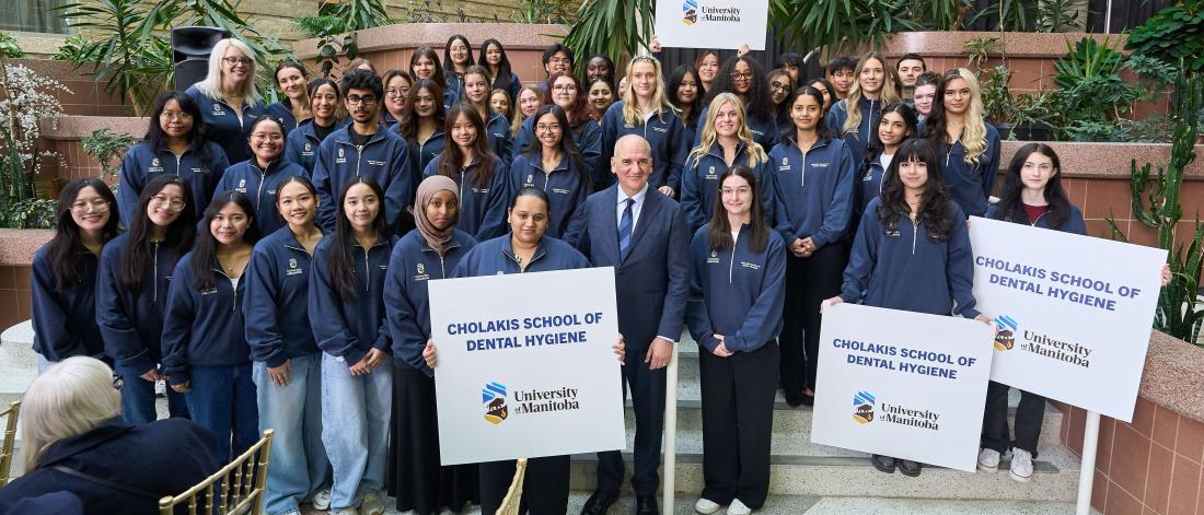 Dr. Cholakis surrounded by dental hygiene students