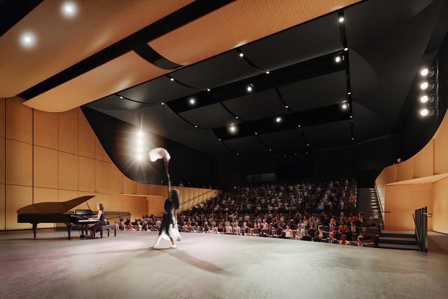A performer on stage at the desautels concert hall.