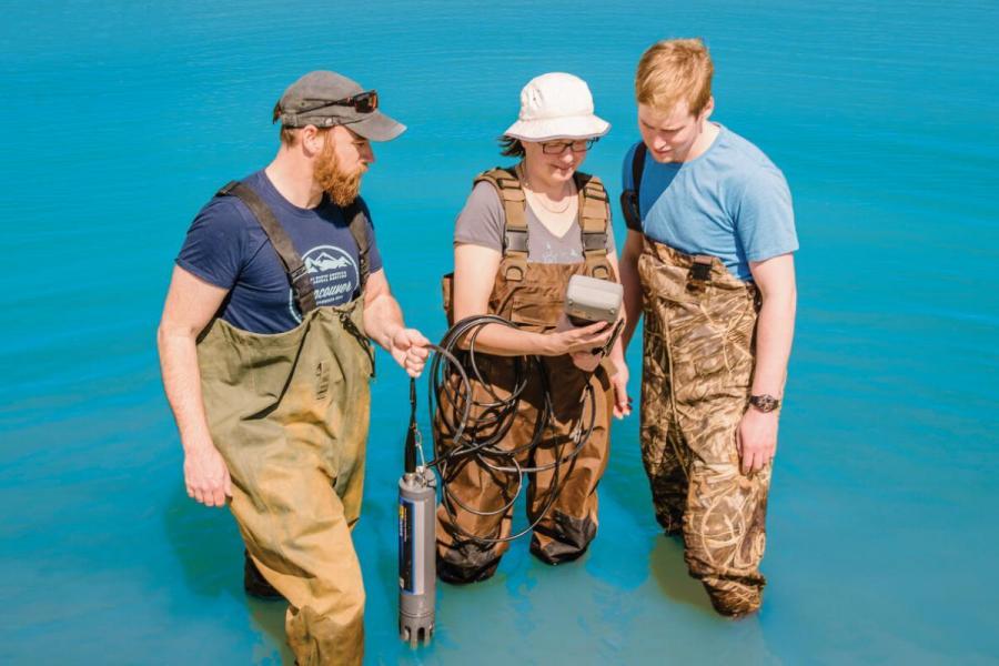 University of Manitoba researchers taking measurements in a body of water.