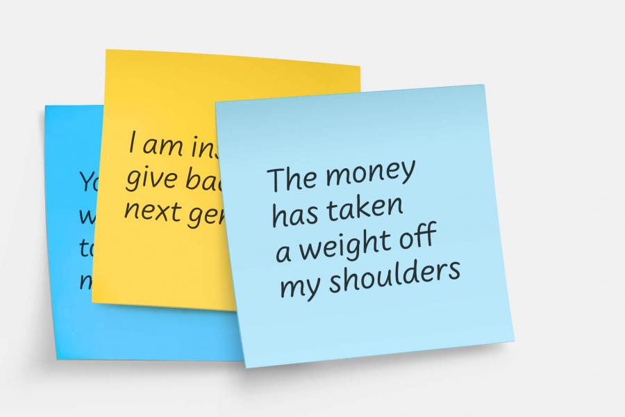 Layered sticky notes with text: The money has taken a weight off my shoulders.