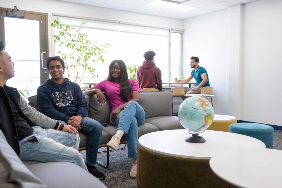 students sitting in a student lounge chatting