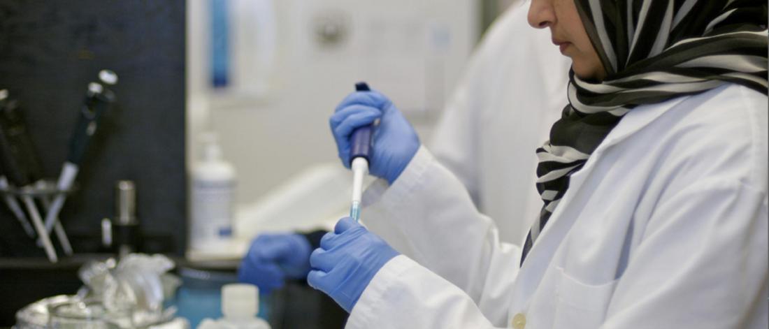 A dentists works with a sample in a lab. 