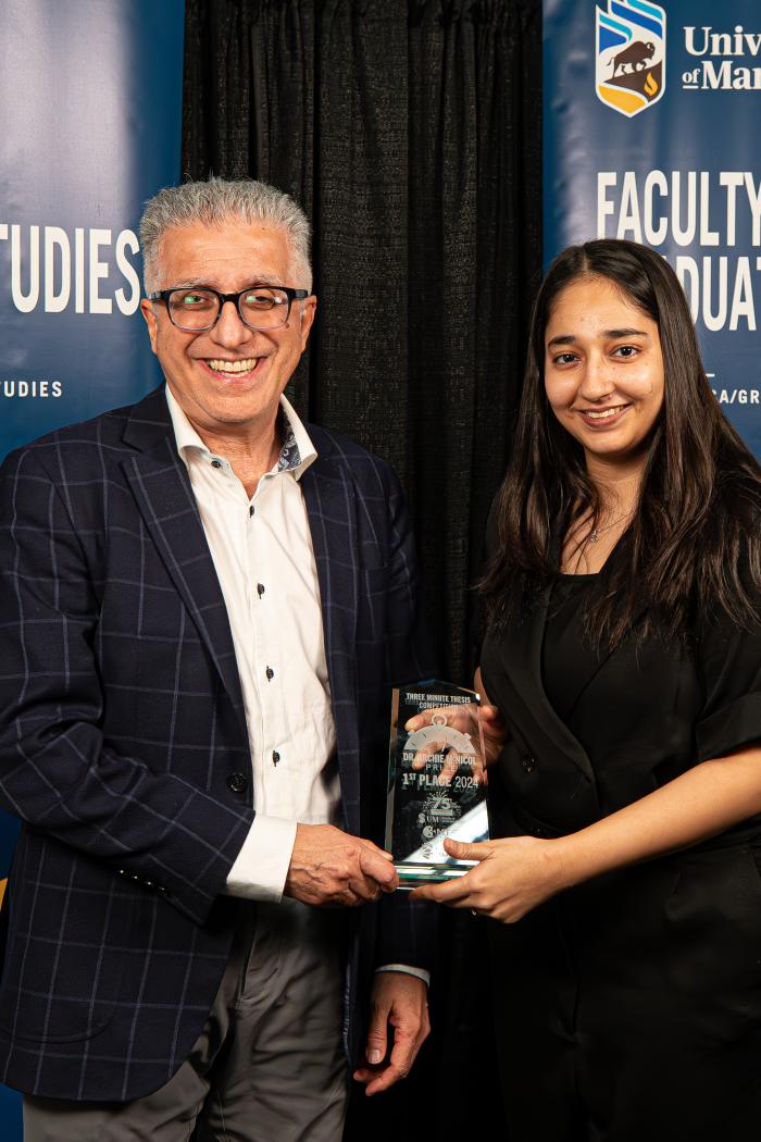Dr. Michael Benarroch presenting Anam Ara 1st place award