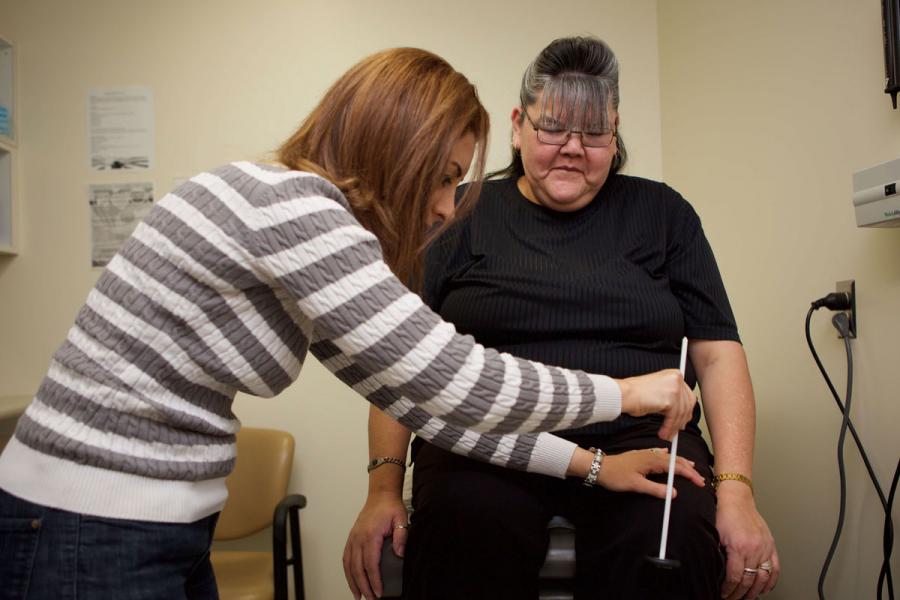 Patient receiving a knee exam.