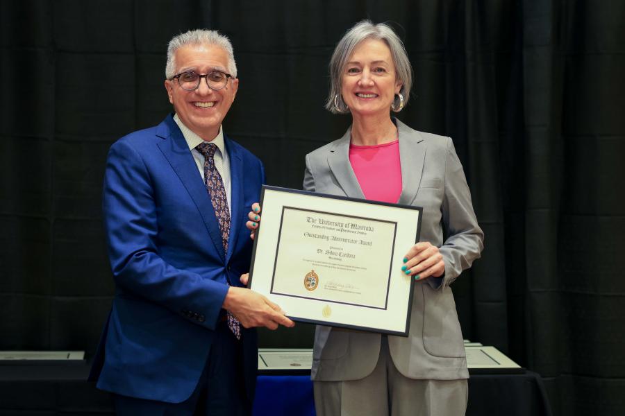 Dr. Benarroch and Dr. Cardona holding an award certificate