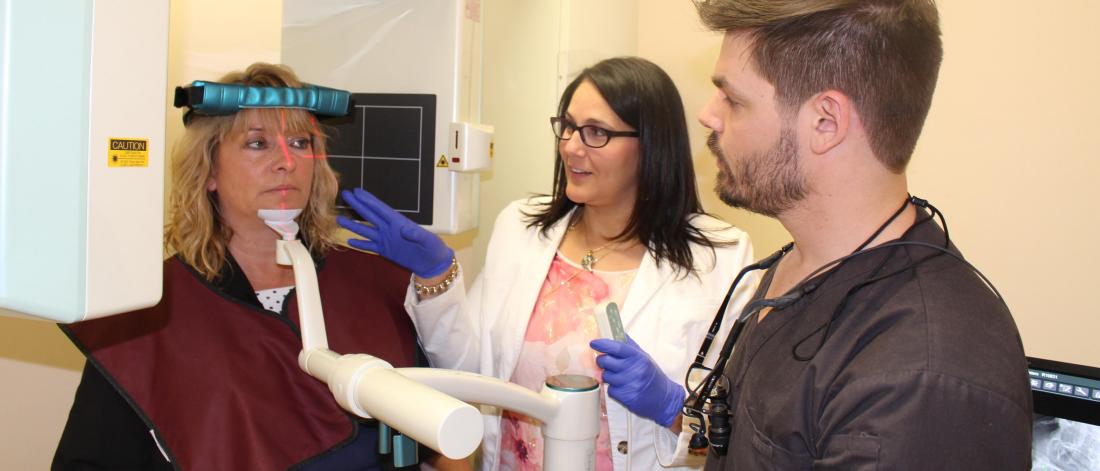 FAculty member demonstrates imaging equipment