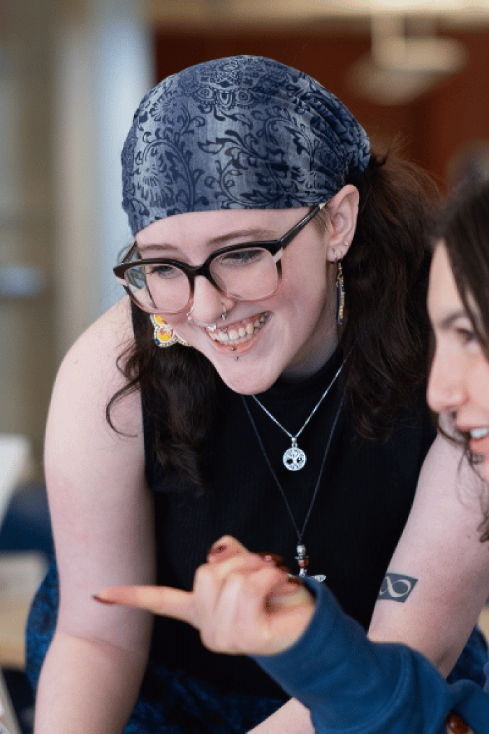 Two students connecting at an Indigenous student program.