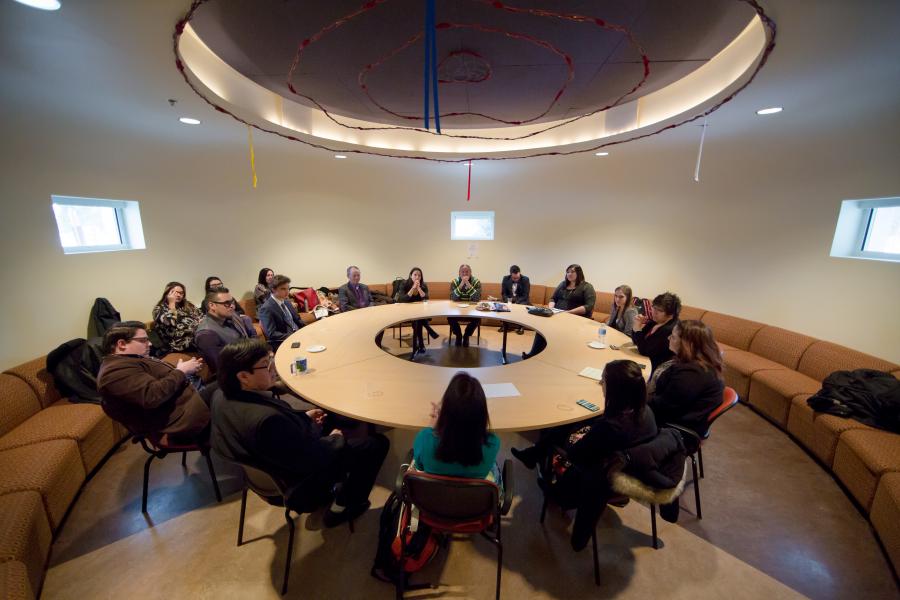A group of people meet in the circle room