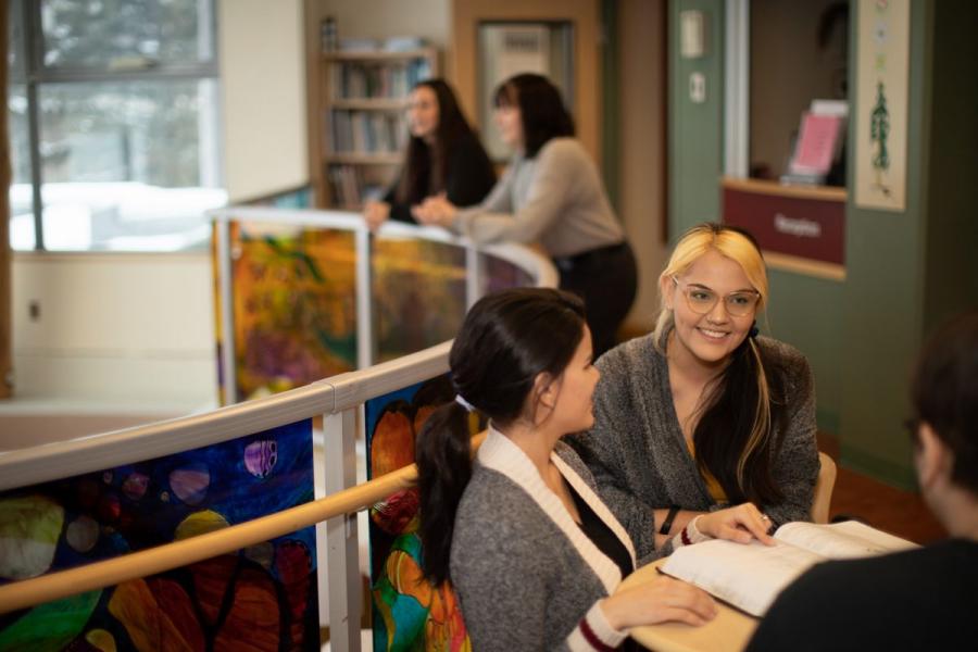 Indigenous students studying together at Migizii Agamik – Bald Eagle Lodge, University of Manitoba.