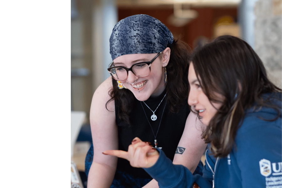 Two students connecting at an Indigenous student program.
