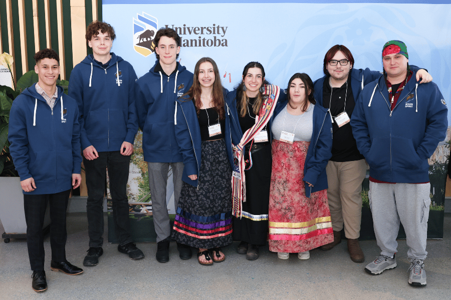 Eight Bison Spirit participants stand together for a group photo at the wrap-up event.