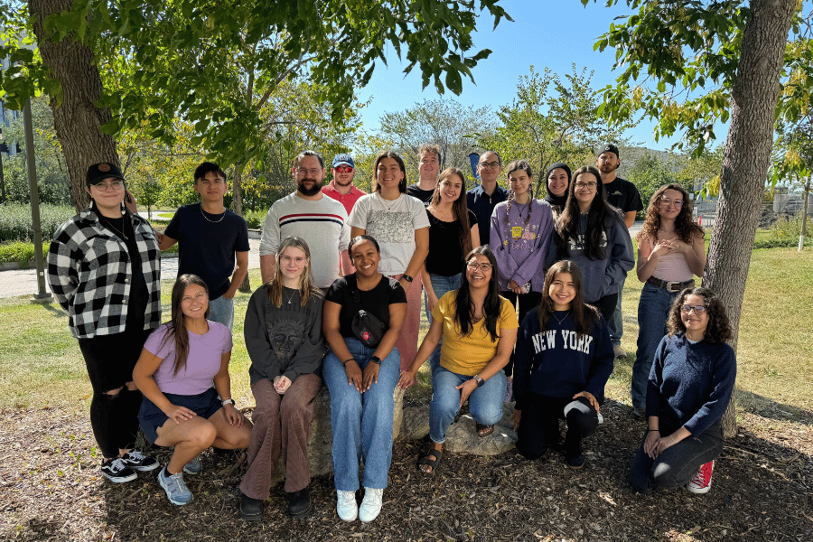 Group photo of Neechiwaken Indigenous Peer Mentor Program participants outdoors on campus.