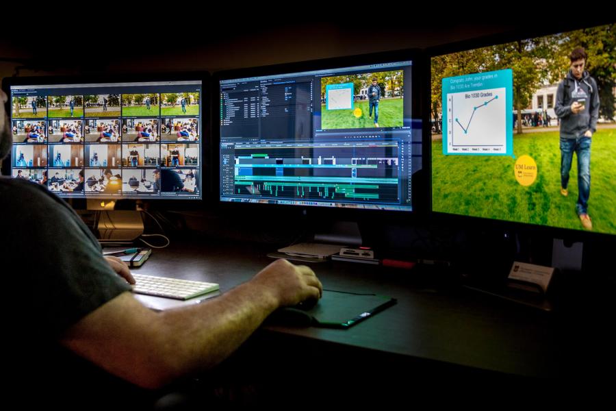 Man editing videos on computer.