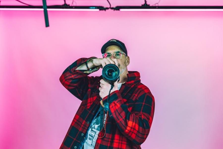 Photographer pointing camera at you