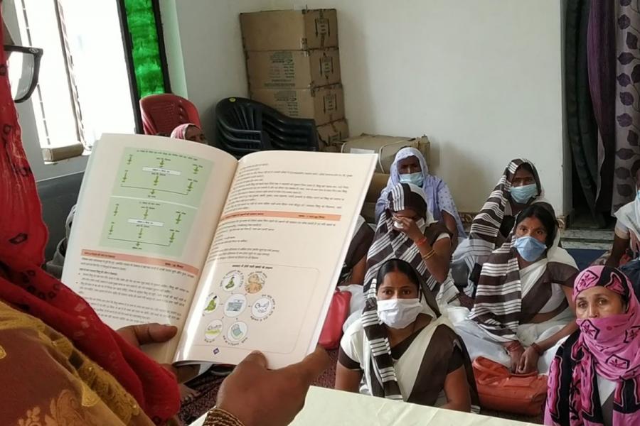 Techer in front of a classroom of students.