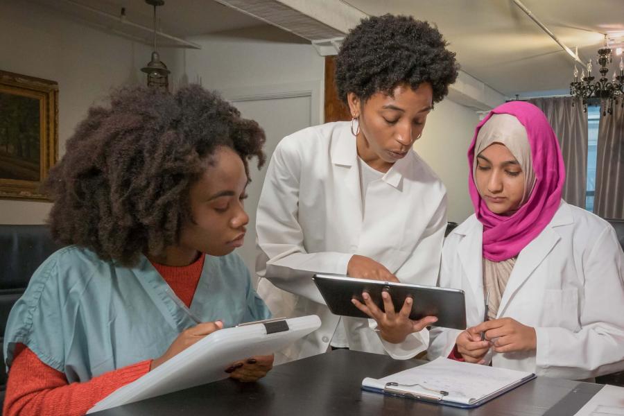 Physicians looking at a file.