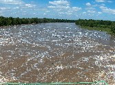 Turbulent water at Red River floodway inlet gates