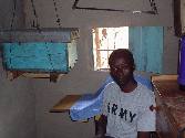 One of Haron's two bee hives kept inside his house - Ileho, Kakamega (Jan. 2004)