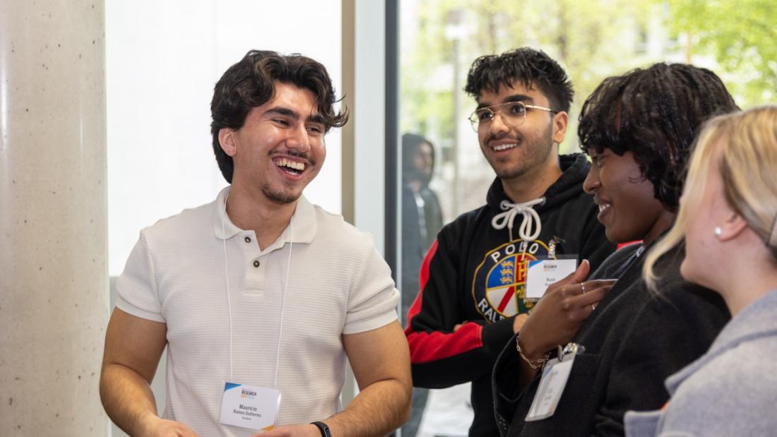 A group of research day partcipants laughing together