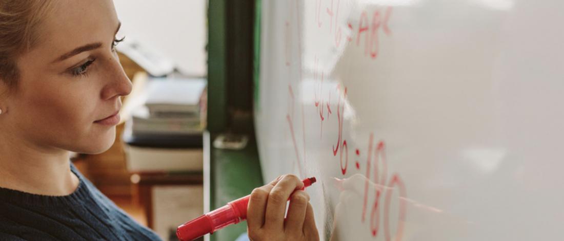 Close up of female student writing an equation on white board in classroom by Jacob Lund from Noun Project