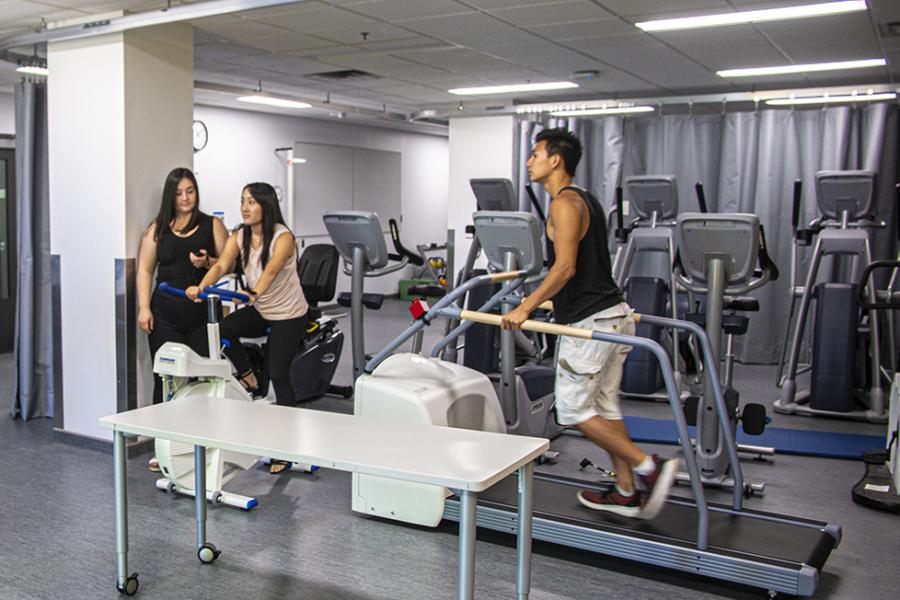 researcher conducting tests on exercise equipment