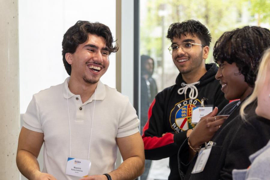 A group of research day partcipants laughing together