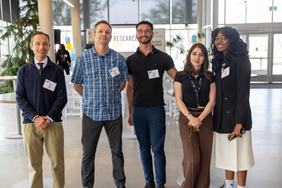 five FKRM researchers standing together smiling