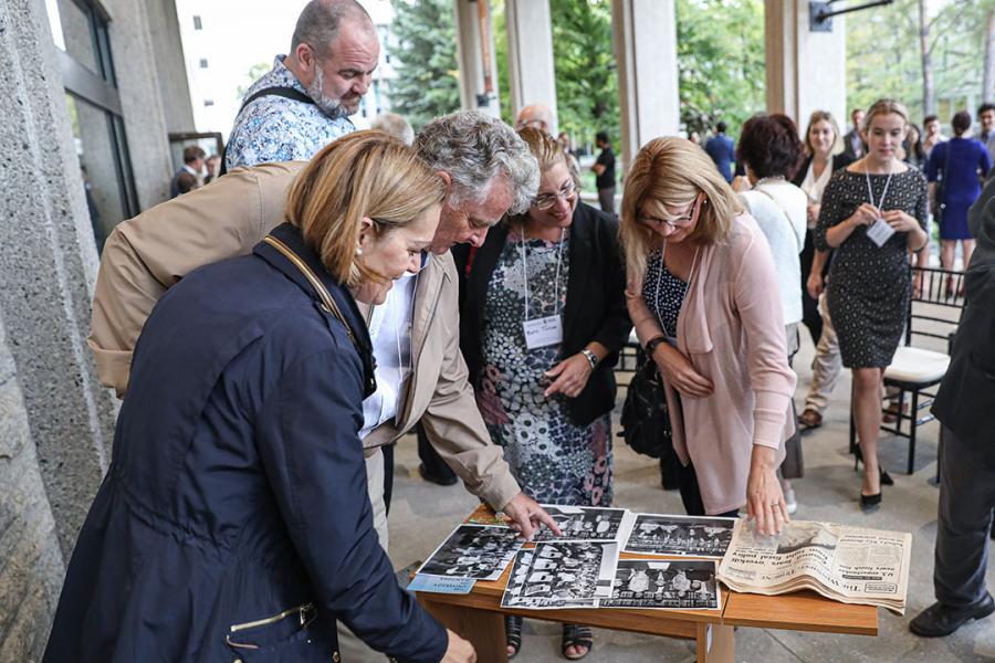 Alumni looking through the contents of the time capsule