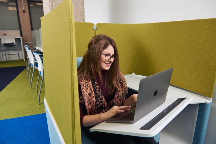 a student studying on her laptop