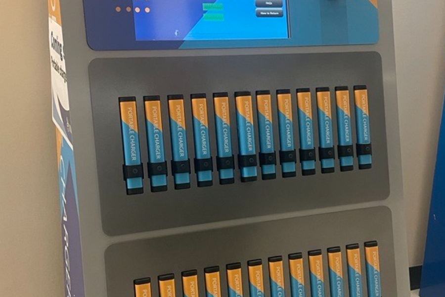 Library kiosk containing 24 portable chargers for loan.