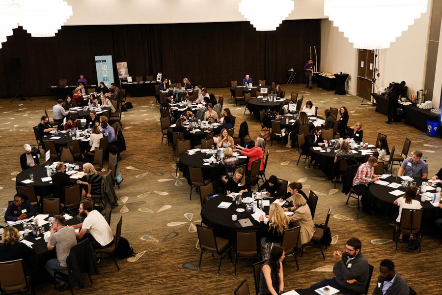 numerous people at tables shot from above