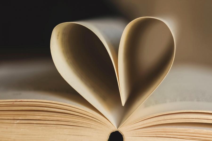 image of book using page to form a heart