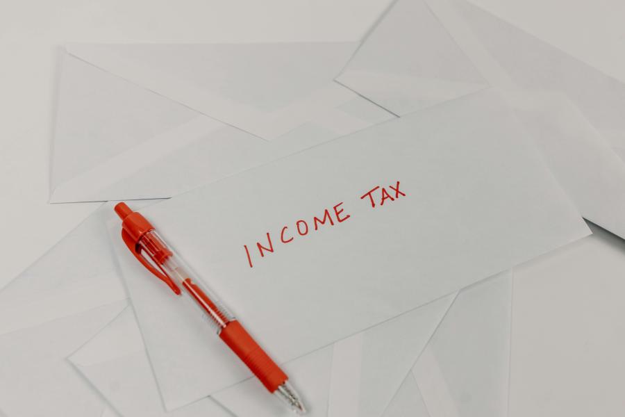 the words 'Income Tax' written on a paper