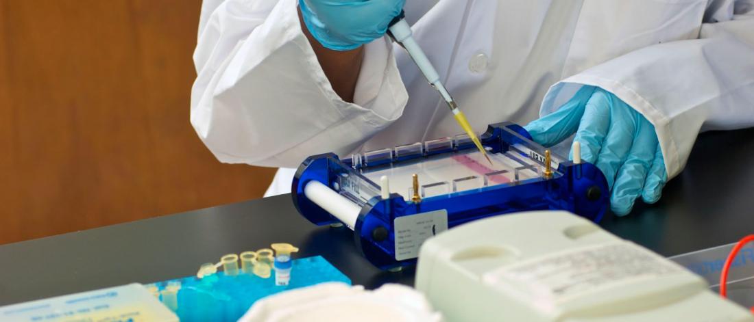 A medical professional works in a lab.