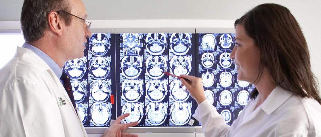 Physicians review brain scans.