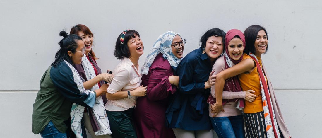 Group of laughing women.