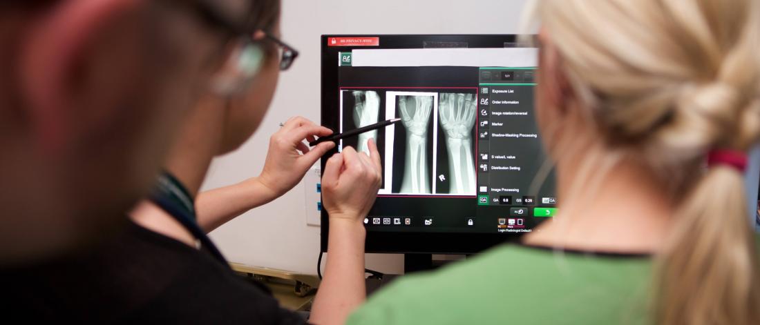 Physicians looking at an xray.