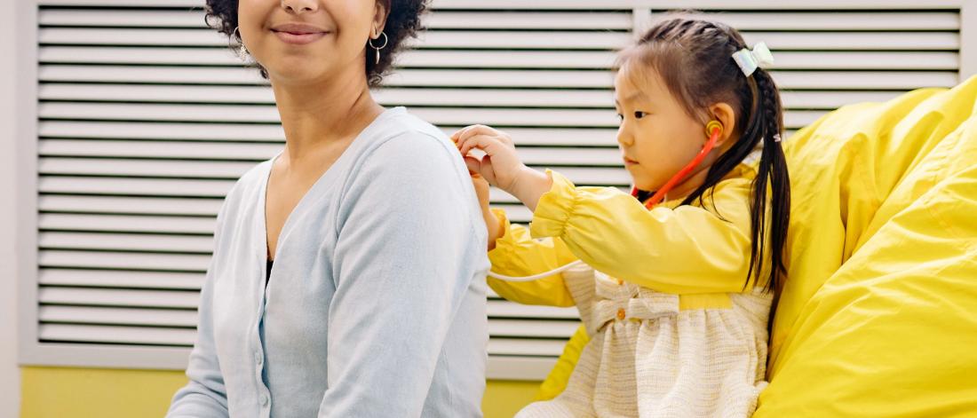 Child playing with her mother.